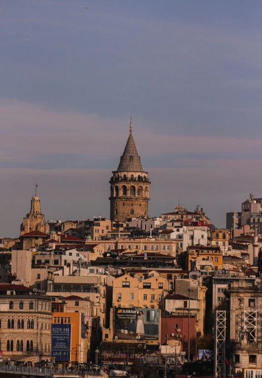 a large clock tower towering over a city, by Cafer Bater, slide show, istanbul, gigapixel photo