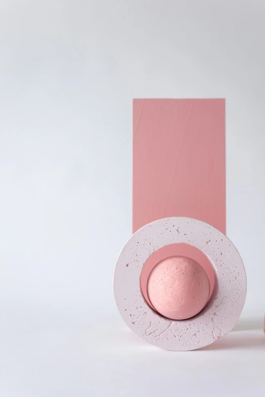 a couple of pink vases sitting next to each other, an abstract sculpture, by Matthias Stom, trending on unsplash, conceptual art, with hat, pink frosted donut, behance lemanoosh, eggshell color