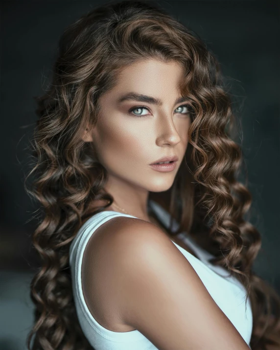 a beautiful young woman with long curly hair, a colorized photo, trending on pexels, hair : long brown, non binary model, glam photo, light brown neat hair