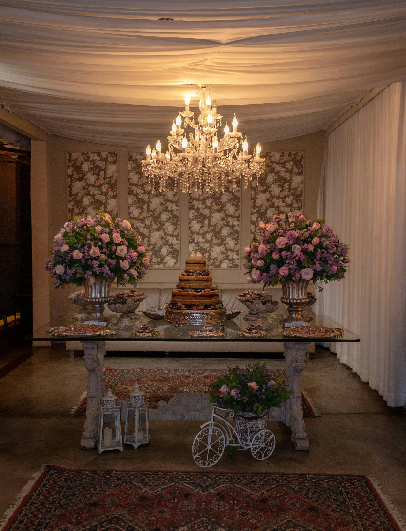 a wedding cake sitting on top of a table under a chandelier, são paulo, a table full of candy, thumbnail, profile image