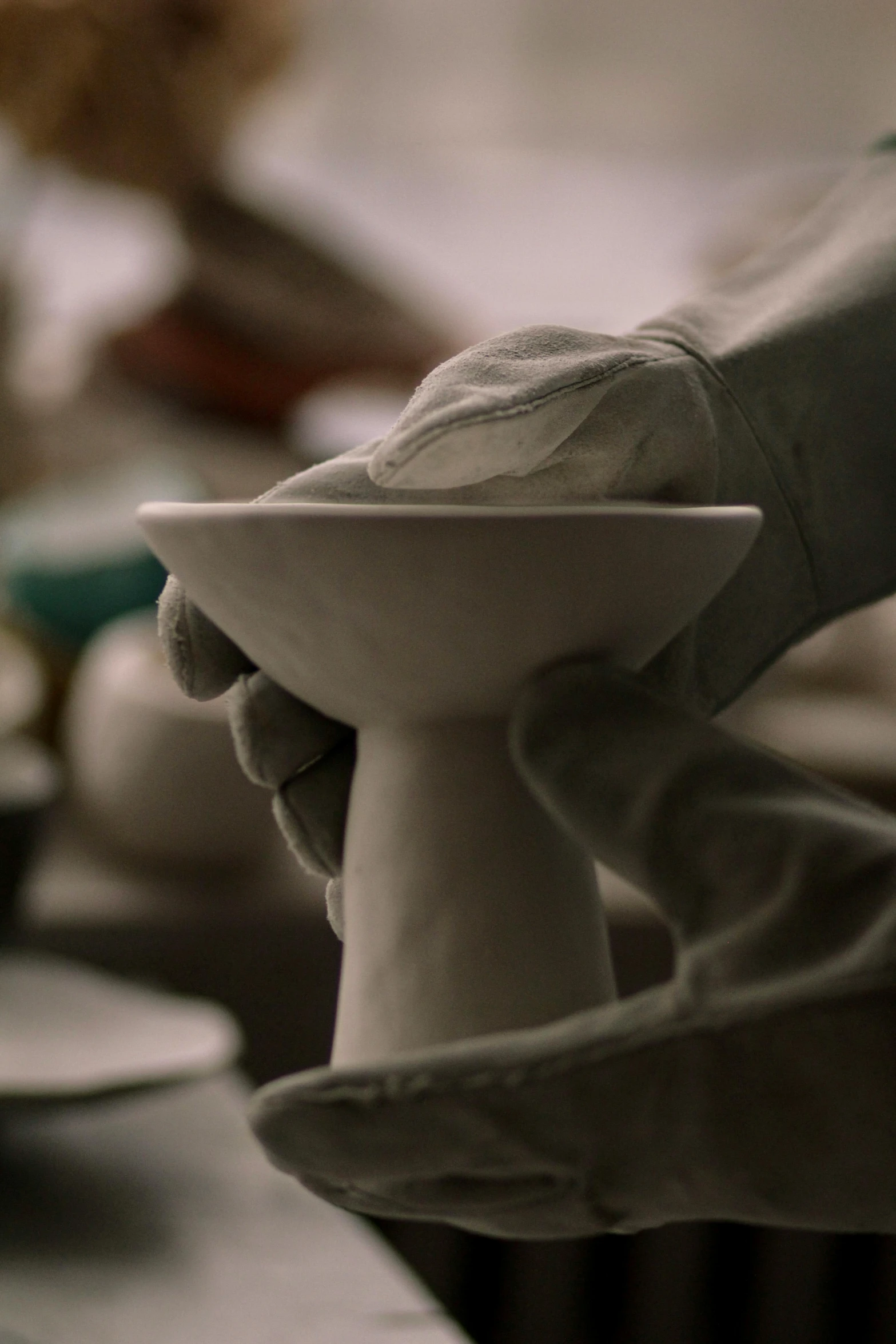 a person is making a bowl out of clay, a marble sculpture, inspired by Hendrik Gerritsz Pot, unsplash, still from the movie ex machina, holding a candle holder, fine china, “ painting