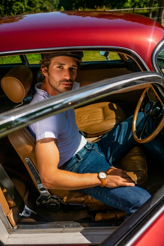 a man sitting in the driver's seat of a red car, renaissance, denim, 40 mm, daniel ricciardo, classic style