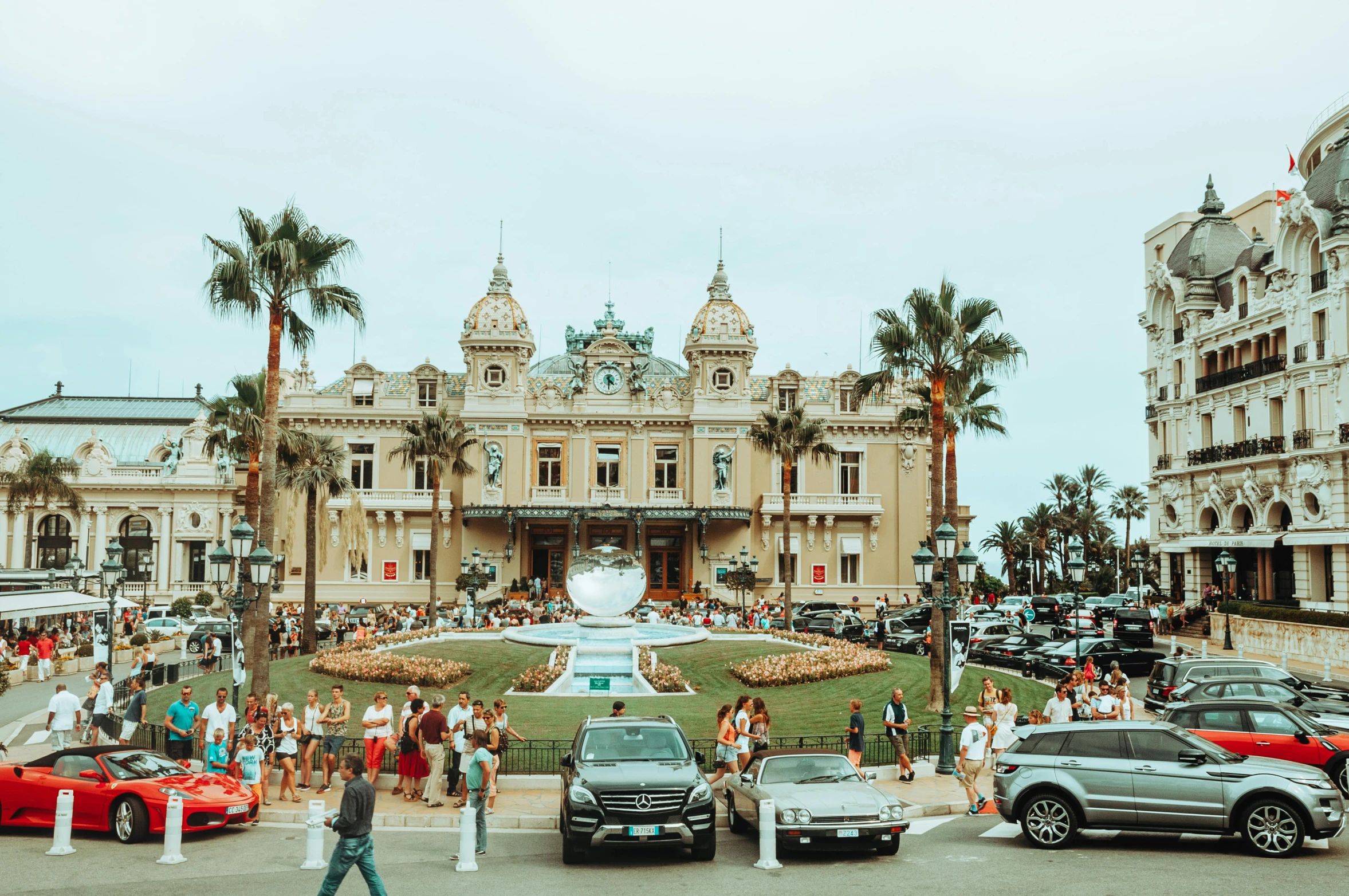 a bunch of cars that are parked in front of a building, a photo, pexels contest winner, art nouveau, monaco, a group of people, 🐿🍸🍋, casino