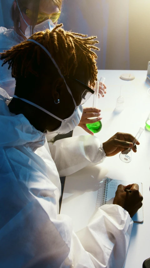 a couple of people that are sitting at a table, trending on pexels, process art, futuristic chemistry lab, young thug, green, labcoat