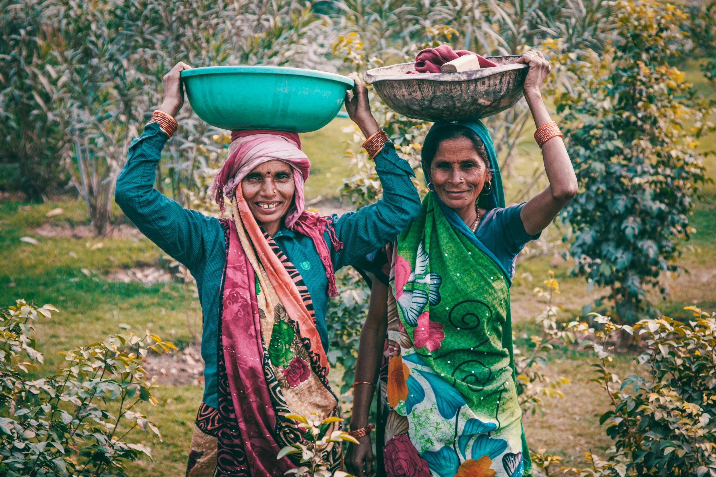 two women carrying baskets on their heads in a field, a portrait, pexels contest winner, indian forest, avatar image, workers, carrying a tray