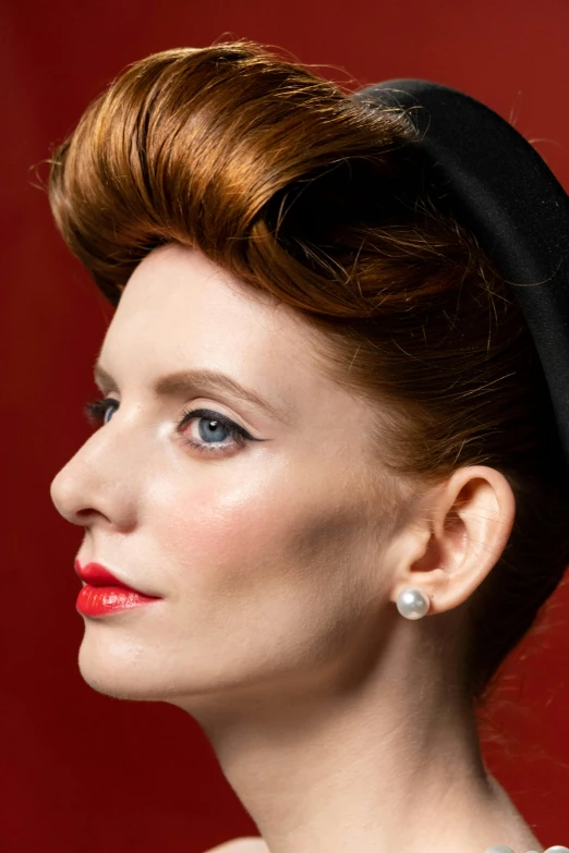 a woman with red hair wearing a black hat, inspired by Man Ray, trending on pexels, photorealism, wearing pearl earrings, promotional image, 1 9 4 0 s haircut, the iron lady