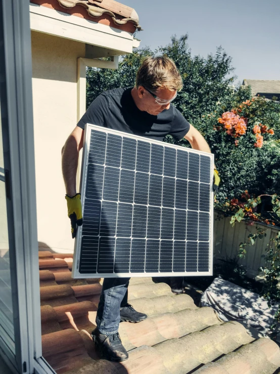 a man holding a solar panel on top of a roof, happening, 3 2 x 3 2, square, 🚀🌈🤩, gardening