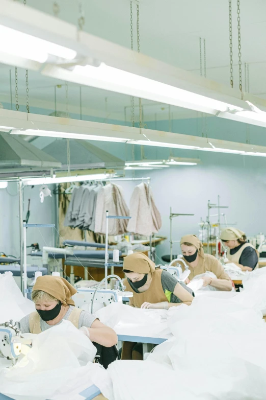 a group of people working in a factory, inspired by Vanessa Beecroft, instagram, ao dai, hospital, premium quality, dreamy soft