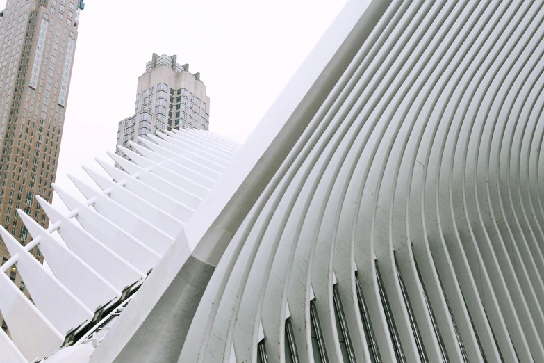 a close up of a building with a clock tower in the background, inspired by Zaha Hadid, pexels contest winner, modernism, met gala, white sweeping arches, grain”