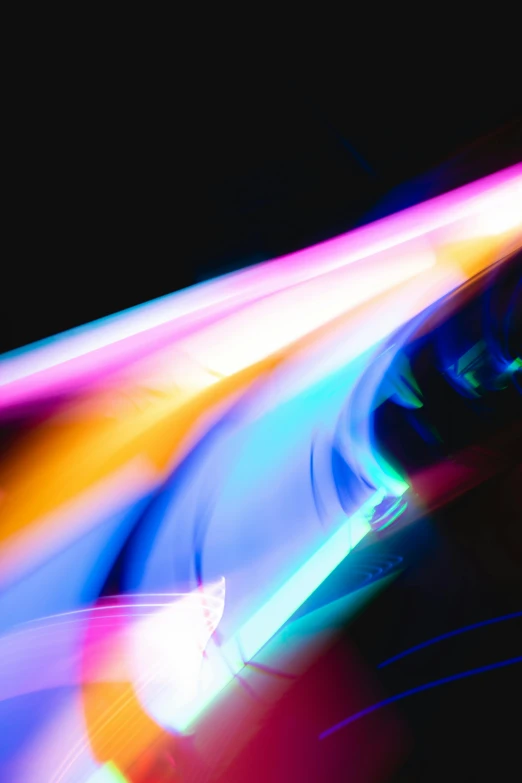 a blurry image of a car in motion, a microscopic photo, by Doug Ohlson, light and space, glowing rainbow neon ink, looking sideways, an abstract, dramatic lighting - n 9