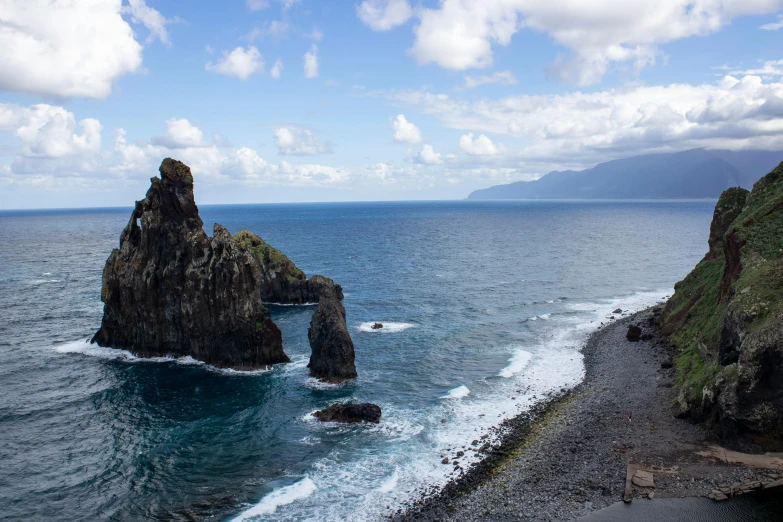 a large body of water next to a rocky shore, pexels contest winner, romanticism, azores, 2 5 6 x 2 5 6 pixels, monoliths, devils horns