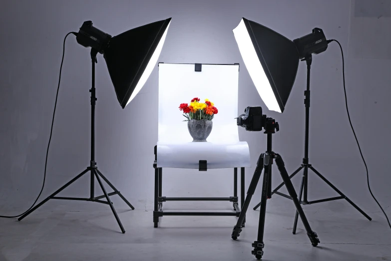 a couple of lights sitting on top of a table, a portrait, inspired by Yousuf Karsh, pixabay, softbox lighting, on a white table, product display, three point lighting