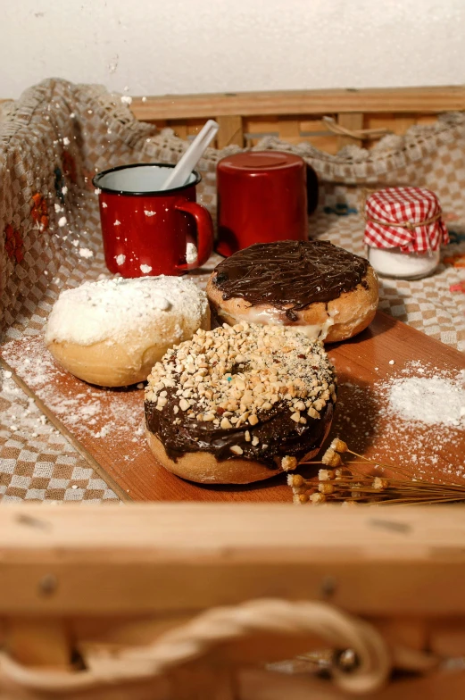 a table topped with donuts covered in powdered sugar, maple syrup & hot fudge, on a wooden tray, kek, fuji choco