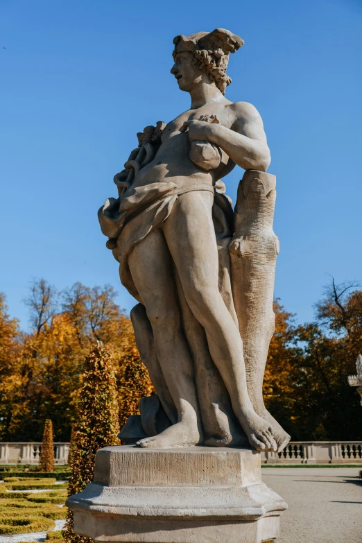 a statue of a woman holding a child, inspired by Károly Markó the Elder, rococo, during autumn, hercules, disrobed, man standing