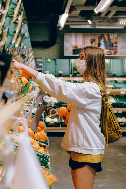 a woman is shopping in a grocery store, pexels, hyperrealism, yellow and green scheme, 🌸 🌼 💮, teenager, australian