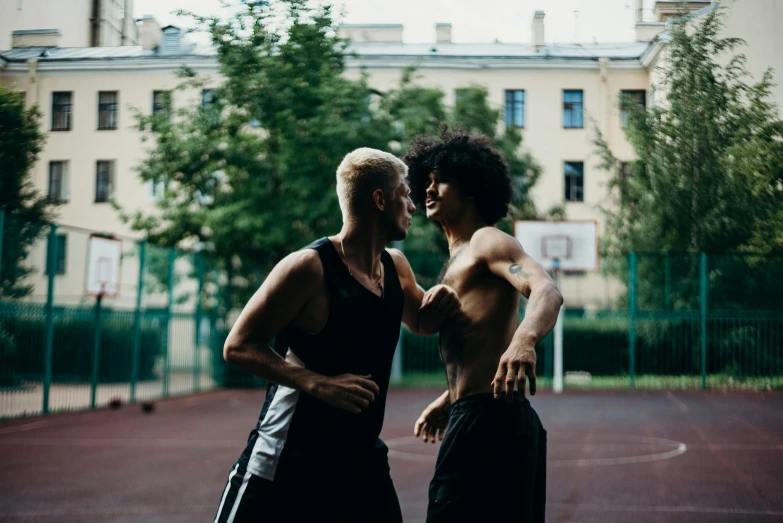 two men standing next to each other on a basketball court, a photo, by Emma Andijewska, pexels contest winner, two muscular men entwined, die antwoord, lesbian, profile image