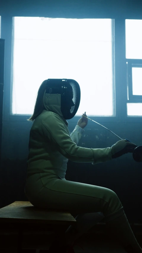 a woman sitting on a bench in front of a window, fencer, wear spacesuits, fighting in a dark scene, promo image