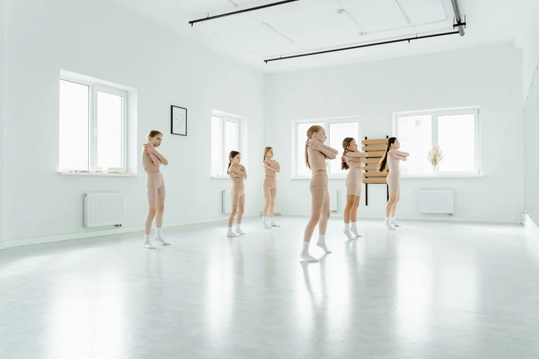 a group of people that are standing in a room, inspired by Vanessa Beecroft, pexels contest winner, girl graceful, school, white studio, фото девушка курит