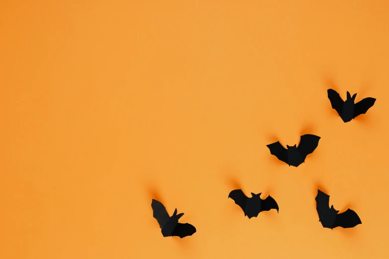 a flock of bats flying in the sky, a cartoon, trending on pexels, conceptual art, orange metal ears, paper cutout, still life photo of a backdrop, 🦩🪐🐞👩🏻🦳