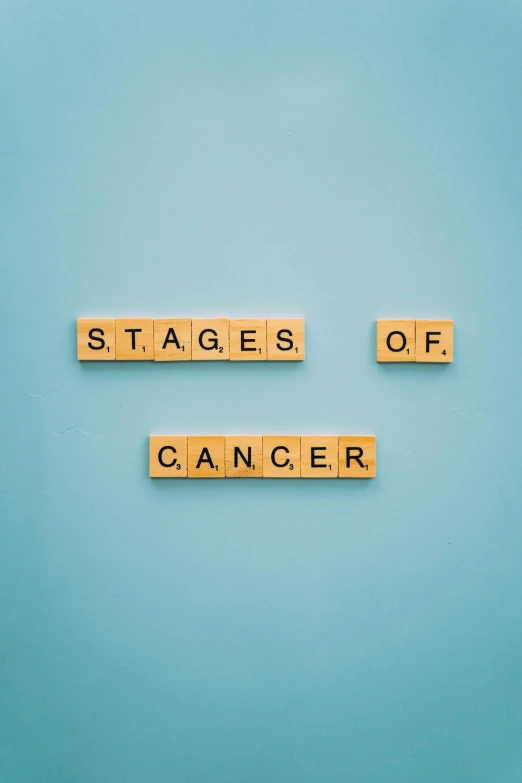 scrabbles spelling stages of cancer on a blue background, a photo, happening, theatre stage, steps, waiting, thumbnail