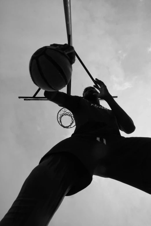 a black and white photo of a basketball player, pexels contest winner, view from below, in the sunset, let's play, monochrome:-2