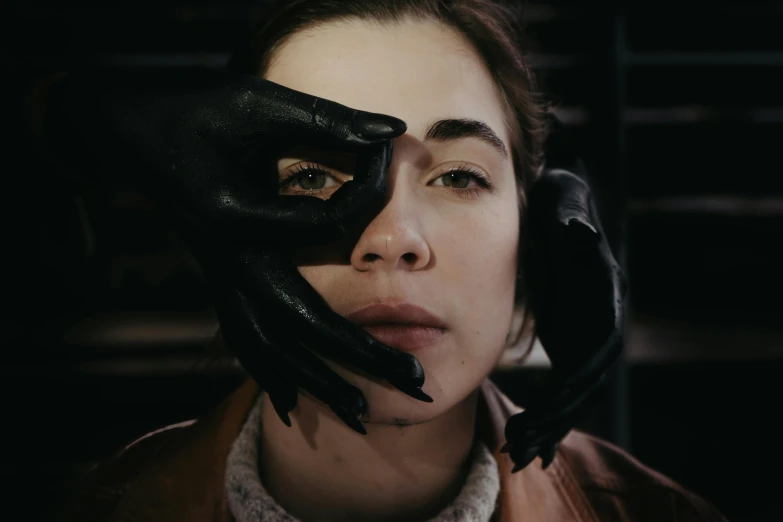 a woman with black gloves covering her face, inspired by Elsa Bleda, trending on pexels, hyperrealism, oona chaplin, gordon freeman as a woman, charli bowater and artgeem, ( ( theatrical ) )