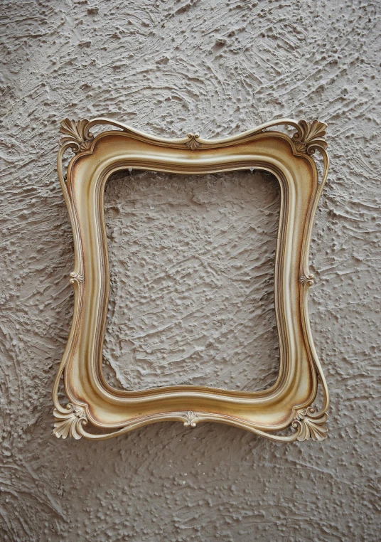 a picture frame hanging on a wall, by artist, unsplash, baroque, square facial structure, craft, framestorevfx, small in size