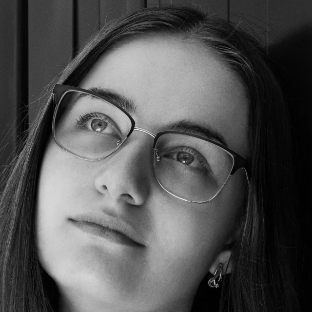 a black and white photo of a woman wearing glasses, by Arthur Sarkissian, pixabay contest winner, portrait of white teenage girl, orthodox, portrait photoreal, 🤤 girl portrait