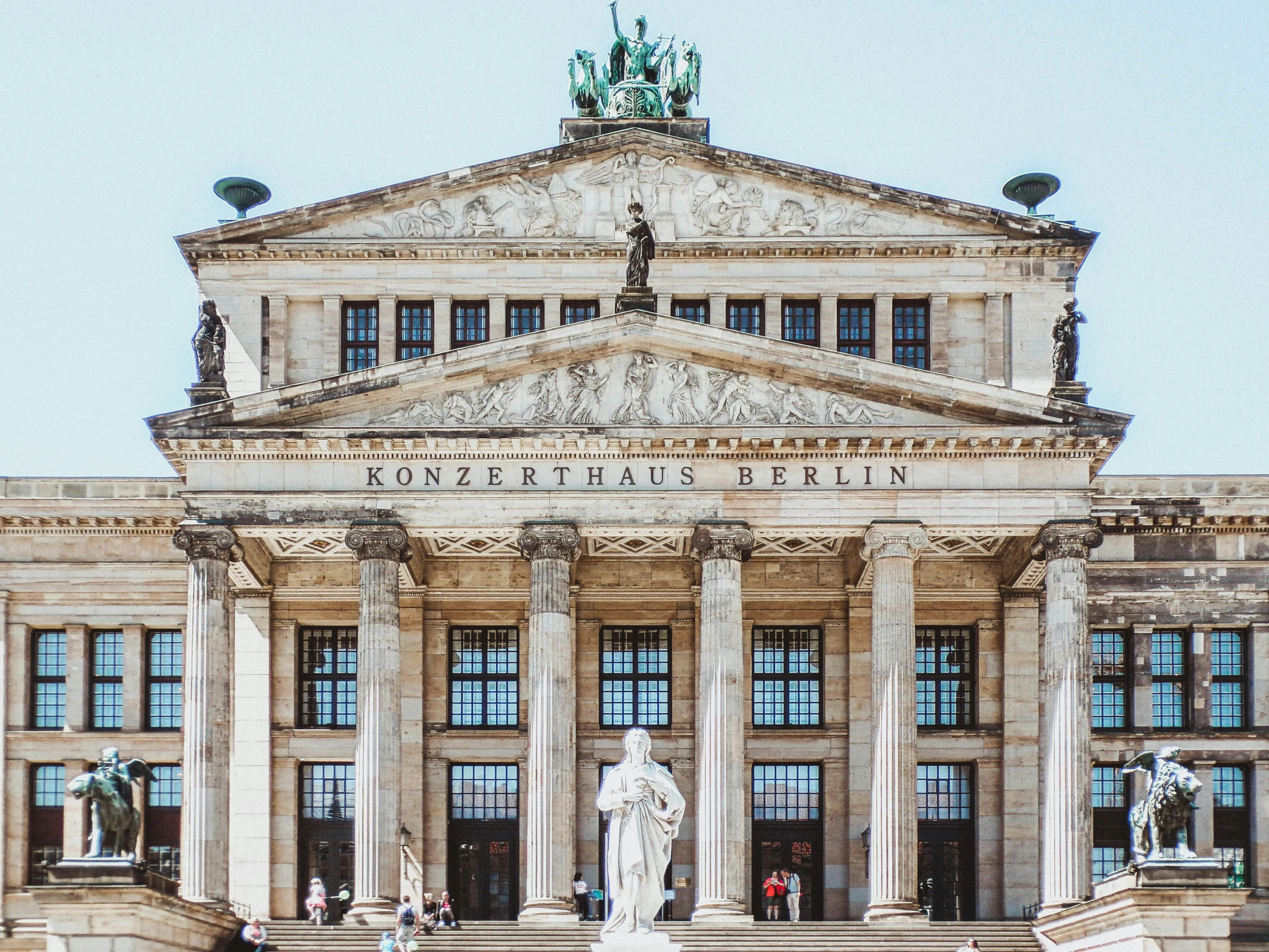 a large building with statues in front of it, by Tom Wänerstrand, pexels contest winner, neoclassicism, palast der republik in berlin, avatar image