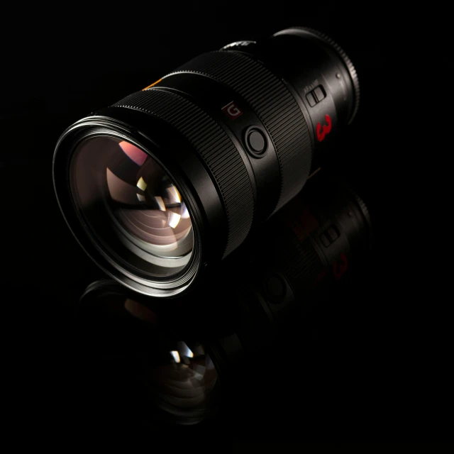 a close up of a camera lens on a black surface, pexels contest winner, dramatic product lighting, dof:-1, gmaster lens, full - frame