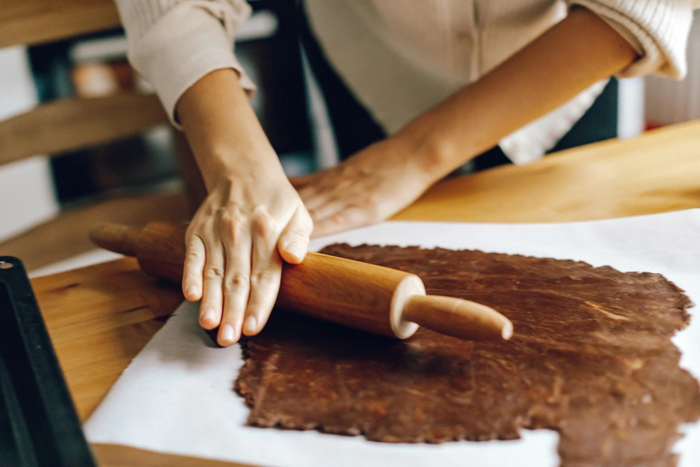 a woman rolling out a cookie with a rolling pin, a woodcut, trending on pexels, fully chocolate, botanicals, dough sculpture, thumbnail