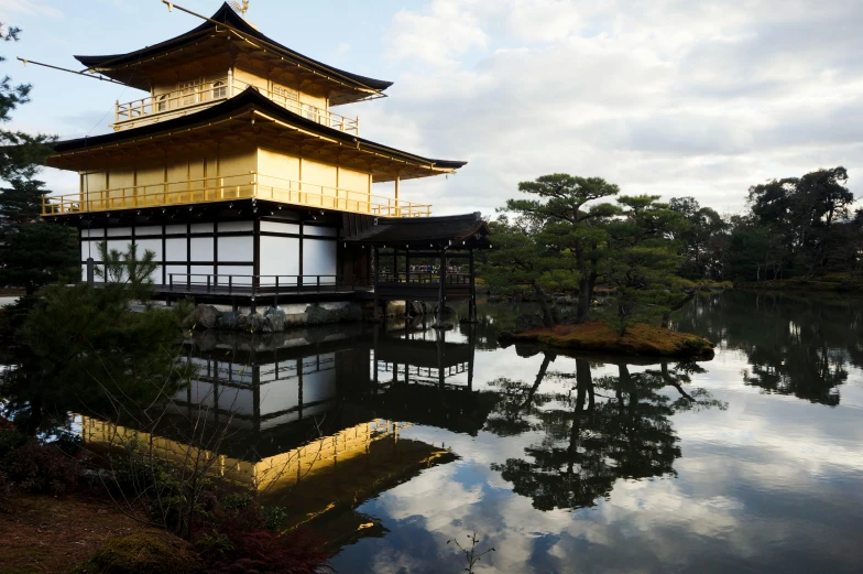 a pagoda sitting on top of a body of water, golden windows, slide show, japanese architecture, exterior shot