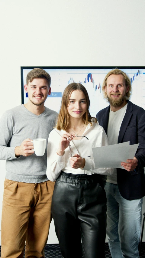 a group of people standing next to each other, in the office, high-quality photo, charts, perfect photo