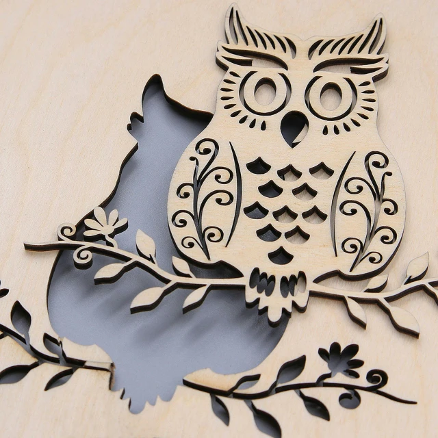 a wooden cutout of an owl sitting on a branch, by Fiona Stephenson, mixture between an! owl and wolf, very detailed and high quality, wall art, shadows