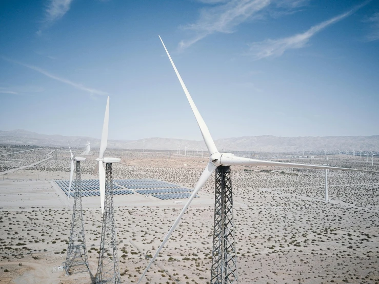 a group of wind turbines sitting in the middle of a desert, a portrait, by Carey Morris, unsplash, joel sternfeld, solar panels, hyperdetailed photo, 2000s photo