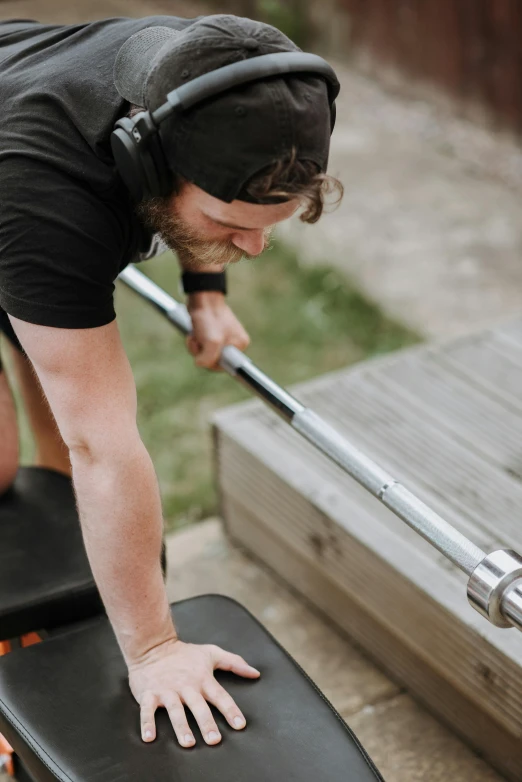 a man that is standing on a skateboard, lifting weights, zoomed in, sitting on a bench, profile image