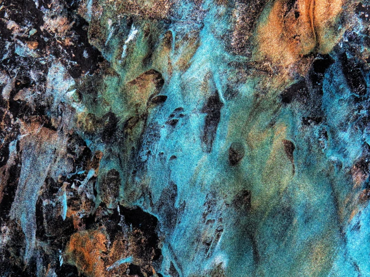 a close up of a rock with blue paint on it, an ultrafine detailed painting, flickr, lava waterfalls, metal surfaces, deep colours. ”, turqouise