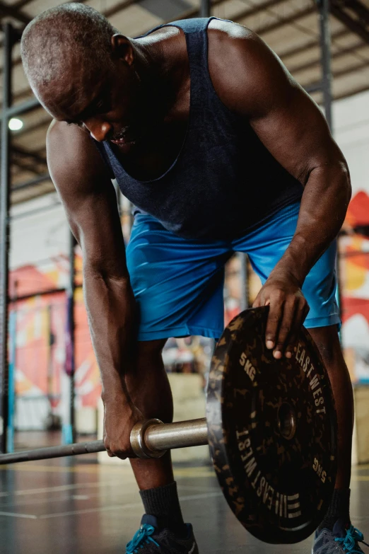 a man lifting a barbell in a gym, by Sam Charles, pexels contest winner, process art, kevin hart, mc ride, instagram story, promo image