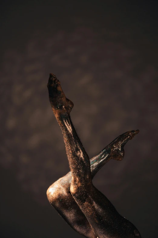 a statue of a man with a knife in his hand, an abstract sculpture, trending on pexels, art photography, bird legs, hand carved brown resin, pterodactyl, macro up view metallic