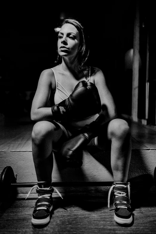 a black and white photo of a woman with boxing gloves, pexels contest winner, figuration libre, squatting, instagram picture, (night), untitled