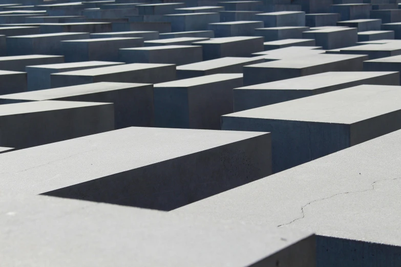 a large group of concrete blocks sitting next to each other, inspired by Adolf Born, pexels contest winner, grey, tourist destination, zig zag, public art