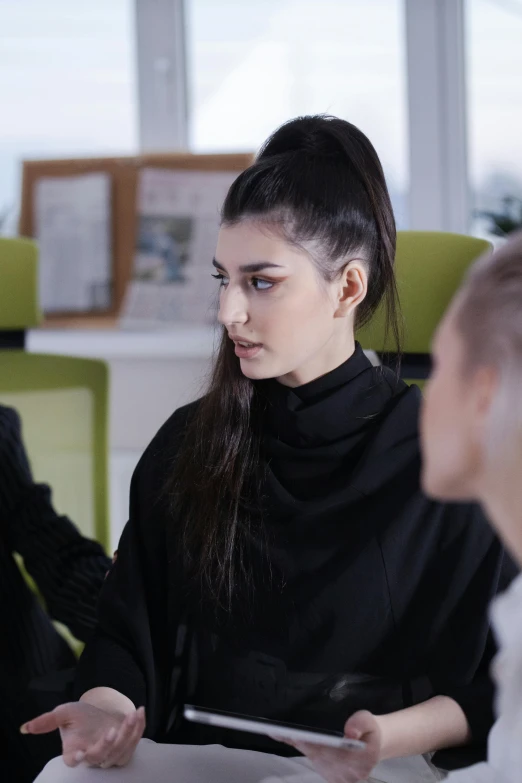 a group of people sitting around a table, trending on pexels, academic art, long black ponytail, attractive androgynous humanoid, female in office dress, young middle eastern woman