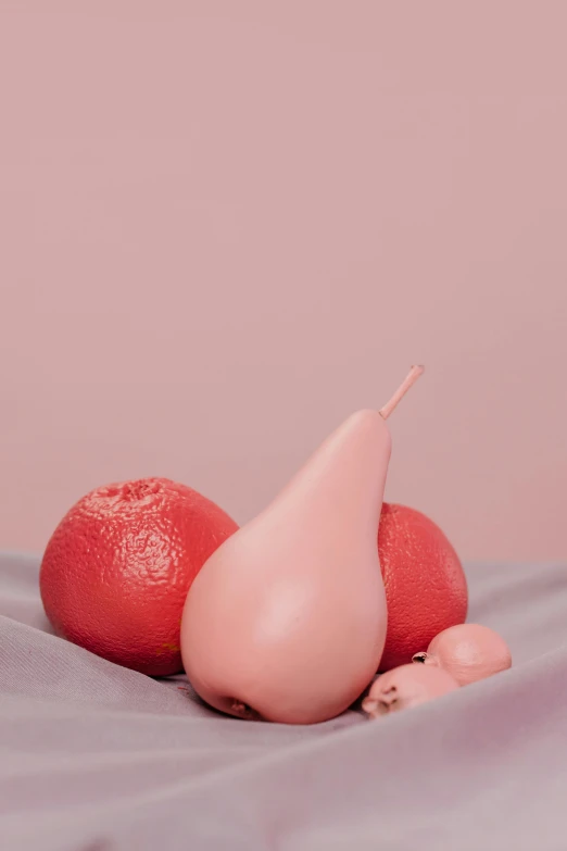 a couple of fruit sitting on top of a bed, by Elsa Bleda, trending on pexels, magic realism, covered in pink flesh, insanely inflated hips, pale red, pear