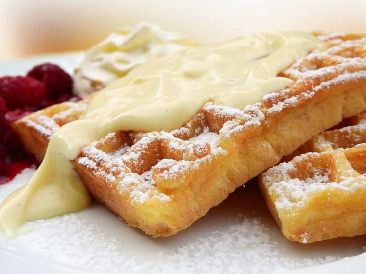 a white plate topped with waffles covered in powdered sugar, pexels, romanticism, square, yellow, long, thumbnail