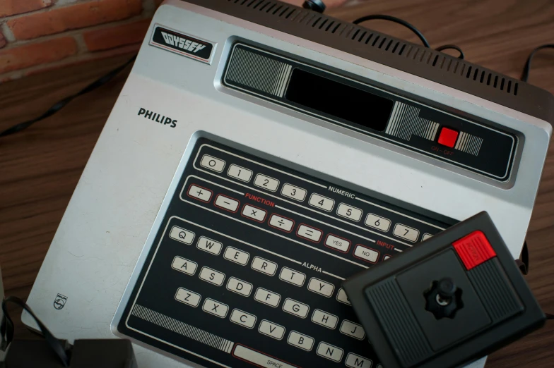 a computer sitting on top of a wooden table, vhs artefacts, holding controller, promo image, triumph