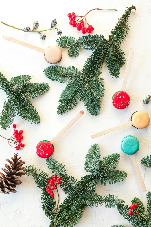 a close up of christmas decorations on a table, macaron, evergreen, profile image, mikado