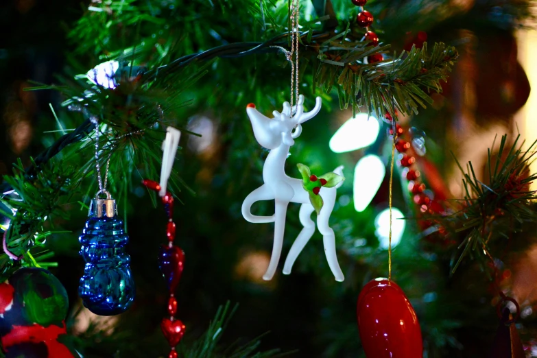a close up of a christmas tree with ornaments, pexels, arabesque, deers, 3 d print, shot on sony a 7, rectangle