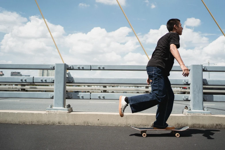 a man riding a skateboard across a bridge, a picture, unsplash, renaissance, joe biden riding a skateboard, denim, wide shot photograph, medium long shot