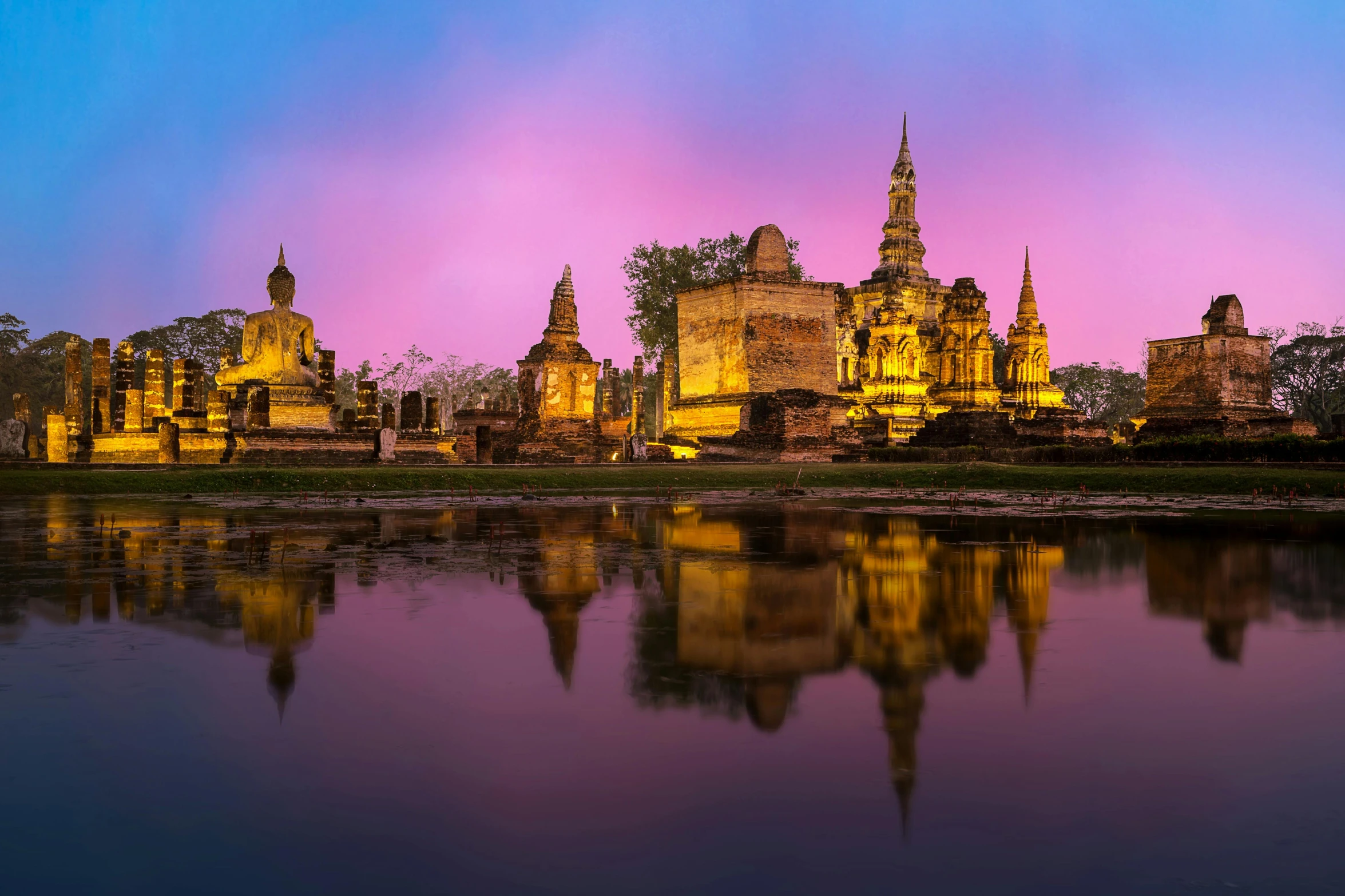 a large building sitting next to a body of water, pexels contest winner, baroque, thai, neon ancient ruins, at dawn, brown