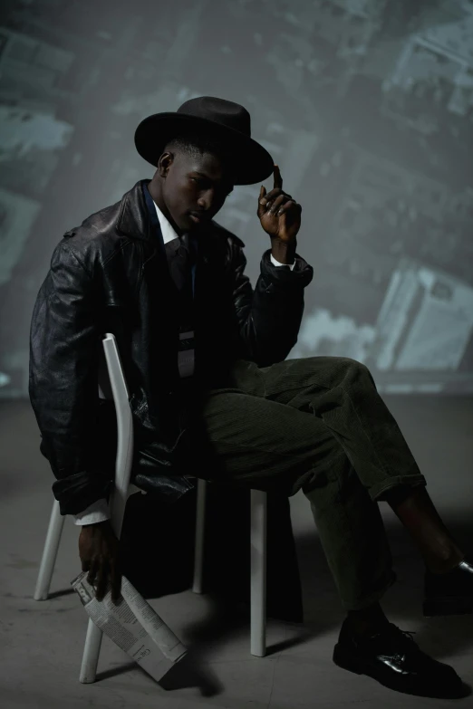 a man sitting on a chair smoking a cigarette, trending on unsplash, harlem renaissance, black stetson and coat, adut akech, man standing in defensive pose, ( ( theatrical ) )